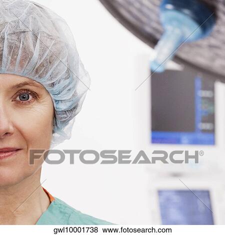 Close-up of a female doctor smirking View Large Photo Image Stock Photo - Close-up of a female doctor smirking. Fotosearch