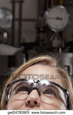 Close-up of a female doctor wearing a protective eyewear View Large Photo Image Stock Image - Close-up of a female doctor wearing a protective eyewear. Fotosearch