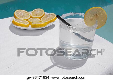 Close-up of a glass of lemonade with lemon slices View Large Photo Image Picture - Close-up of a glass of lemonade with lemon slices. Fotosearch