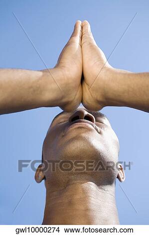 Close-up of a man meditating View Large Photo Image Picture - Close-up of a man meditating. Fotosearch