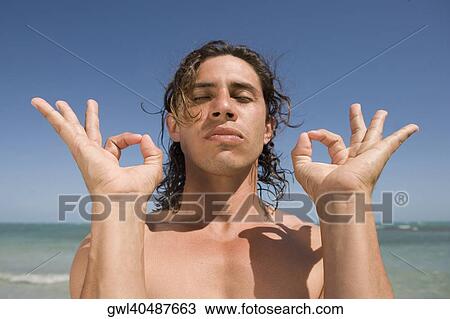 Close-up of a man meditating View Large Photo Image Stock Image - Close-up of a man meditating. Fotosearch