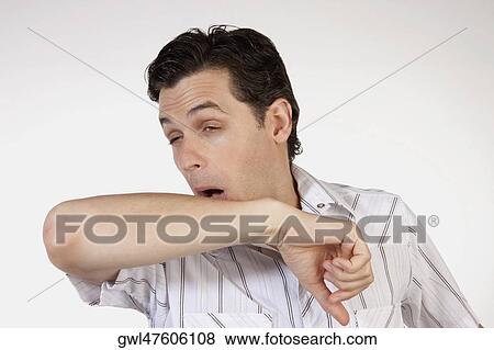 Close-up of a man sneezing View Large Photo Image Stock Photo - Close-up of a man sneezing. Fotosearch