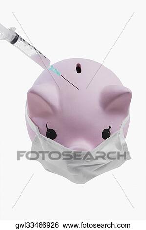 Close-up of a piggy bank and a syringe View Large Photo Image Stock Photograph - Close-up of a piggy bank and a syringe. Fotosearch