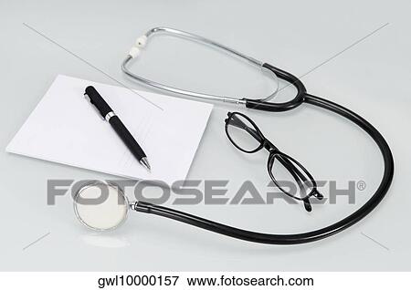 Close-up of a stethoscope with pen and prescription pad View Large Photo Image Stock Photo - Close-up of a stethoscope with pen and prescription pad. Fotosearch