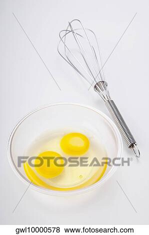 Close-up of a wire whisk and egg yolk in a bowl View Large Photo Image Stock Photo - Close-up of a wire whisk and egg yolk in a bowl. Fotosearch