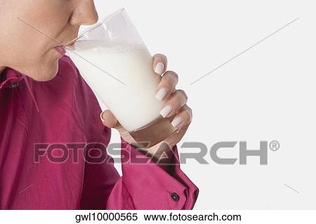 Close-up of a woman drinking milk from a glass View Large Photo Image Stock Photography - Close-up of a woman drinking milk from a glass. Fotosearch