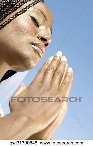 Stock Photography - Close-up of a woman meditating. Fotosearch