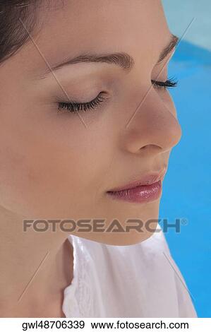 Stock Photo - Close-up of a woman practicing yoga. Fotosearch