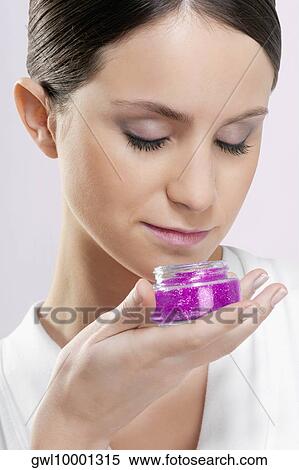 Close-up of a woman smelling aroma gel View Large Photo Image Stock Photography - Close-up of a woman smelling aroma gel. Fotosearch