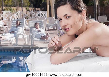 Close-up of a woman smelling lavender flowers View Large Photo Image Stock Photograph - Close-up of a woman smelling lavender flowers. Fotosearch