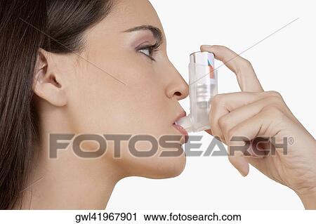 Close-up of a woman using an inhaler View Large Photo Image Stock Image - Close-up of a woman using an inhaler. Fotosearch
