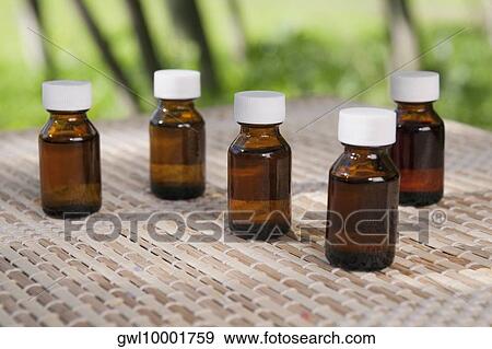 Close-up of aromatherapy oil bottles View Large Photo Image Stock Photo - Close-up of aromatherapy oil bottles. Fotosearch