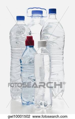 Close-up of assorted bottles of water View Large Photo Image Stock Image - Close-up of assorted bottles of water. Fotosearch