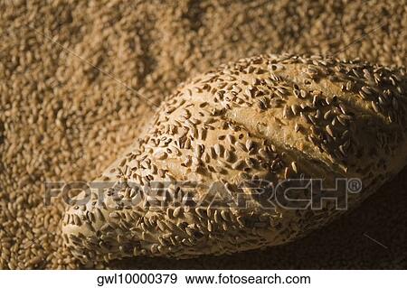 Close-up of bread with wheat View Large Photo Image Stock Photo - Close-up of bread with wheat. Fotosearch