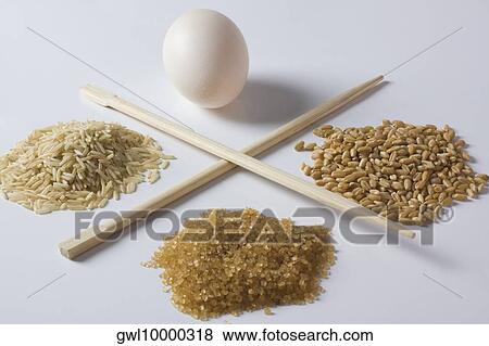 Close-up of brown foods with an egg View Large Photo Image Stock Photo - Close-up of brown foods with an egg. Fotosearch