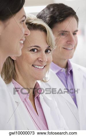 Close-up of doctors smiling in a laboratory View Large Photo Image Stock Image - Close-up of doctors smiling in a laboratory. Fotosearch