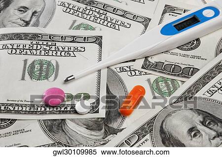 Close-up of hundred dollar bills with pills and a thermometer View Large Photo Image Stock Photography - Close-up of hundred dollar bills with pills and a thermometer. Fotosearch