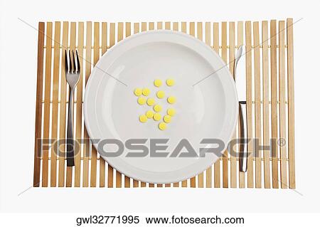 Close-up of pills on a plate View Large Photo Image Stock Photography - Close-up of pills on a plate. Fotosearch