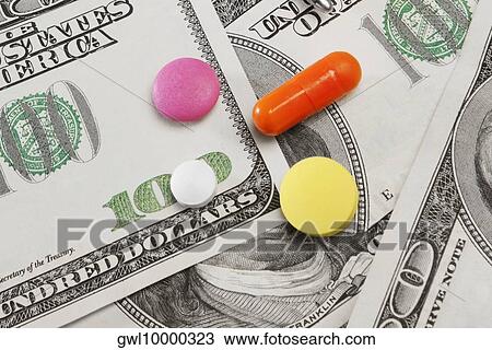 Close-up of pills on hundred dollar bills View Large Photo Image Stock Image - Close-up of pills on hundred dollar bills. Fotosearch