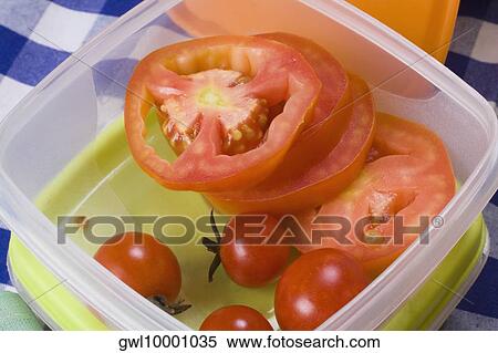 Close-up of tomato slices and cherry tomatoes in a box View Large Photo Image Stock Photography - Close-up of tomato slices and cherry tomatoes in a box. Fotosearch