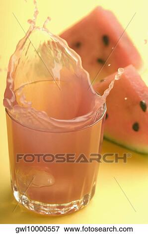 Close-up of watermelon with a glass of watermelon juice View Large Photo Image Stock Photo - Close-up of watermelon with a glass of watermelon juice. Fotosearch