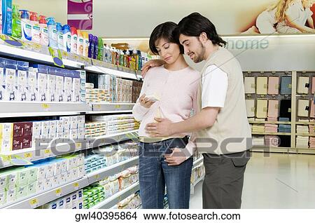 Couple buying cosmetics in a supermarket View Large Photo Image Picture - Couple buying cosmetics in a supermarket. Fotosearch