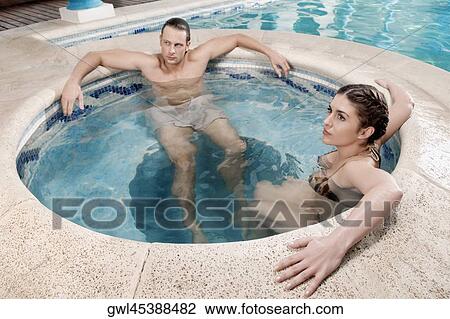 Couple relaxing in a hot tub View Large Photo Image Stock Image - Couple relaxing in a hot tub. Fotosearch