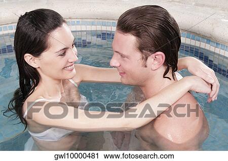Couple romancing in a hot tub View Large Photo Image Stock Image - Couple romancing in a hot tub. Fotosearch