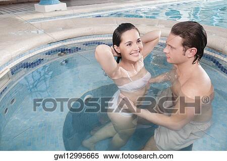 Couple romancing in a hot tub View Large Photo Image Stock Photography - Couple romancing in a hot tub. Fotosearch