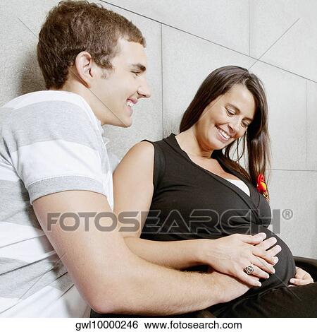 Couple sitting in a hospital waiting room View Large Photo Image Stock Photograph - Couple sitting in a hospital waiting room. Fotosearch