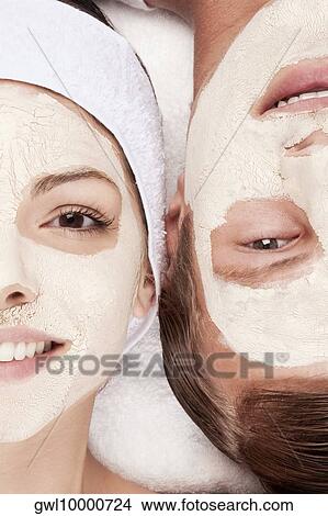 Couple with face pack on their faces View Large Photo Image Picture - Couple with face pack on their faces. Fotosearch