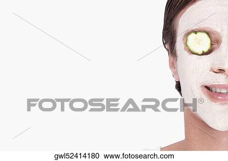 Cucumber slice on a man's eye View Large Photo Image Stock Image - Cucumber slice on a man's eye. Fotosearch