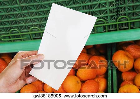 Customer's hands holding a shopping list View Large Photo Image Stock Photography - Customer's hands holding a shopping list. Fotosearch