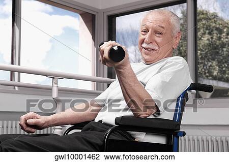 Disabled man exercising with dumbbells View Large Photo Image Stock Image - Disabled man exercising with dumbbells. Fotosearch