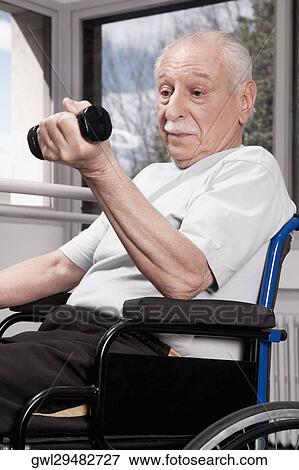 Disabled man exercising with dumbbells View Large Photo Image Stock Photo - Disabled man exercising with dumbbells. Fotosearch