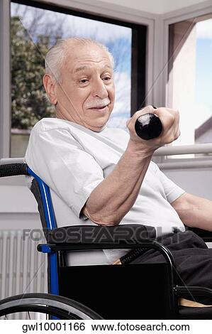 Disabled man exercising with dumbbells View Large Photo Image Stock Photograph - Disabled man exercising with dumbbells. Fotosearch