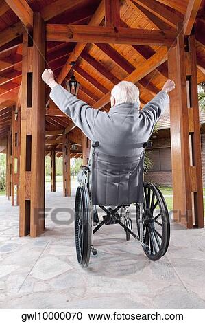Stock Image - Disabled man sitting in a wheelchair. Fotosearch