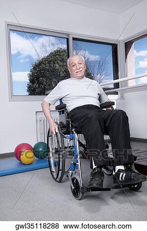 Stock Photo - Disabled man sitting in a wheelchair. Fotosearch