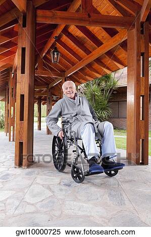 Disabled man sitting in a wheelchair View Large Photo Image Stock Photography - Disabled man sitting in a wheelchair. Fotosearch
