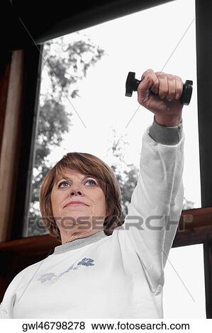 Disabled woman exercising with dumbbells View Large Photo Image Stock Photo - Disabled woman exercising with dumbbells. Fotosearch