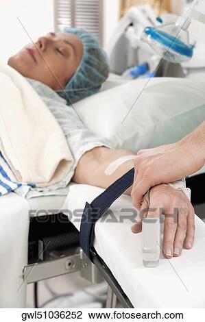 Doctor attaching pulse oxymeter to a patient's finger View Large Photo Image Stock Image - Doctor attaching pulse oxymeter to a patient's finger. Fotosearch