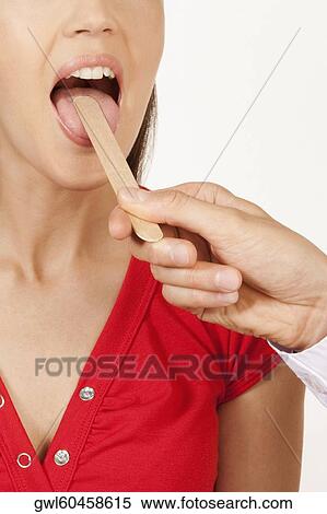 Doctor examining a woman View Large Photo Image Stock Photography - Doctor examining a woman. Fotosearch