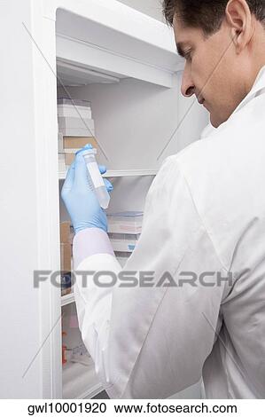 Doctor holding a medical sample in a laboratory View Large Photo Image Stock Image - Doctor holding a medical sample in a laboratory. Fotosearch