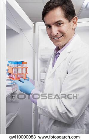 Doctor holding medical samples in a laboratory View Large Photo Image Stock Image - Doctor holding medical samples in a laboratory. Fotosearch