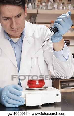 Doctor researching in a laboratory View Large Photo Image Picture - Doctor researching in a laboratory. Fotosearch