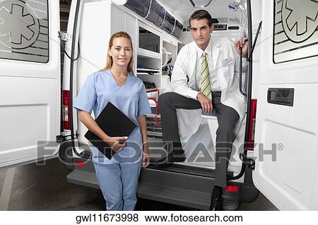 Doctor with a female nurse in an ambulance View Large Photo Image Stock Photo - Doctor with a female nurse in an ambulance. Fotosearch