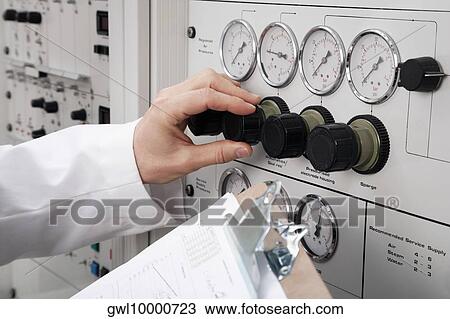 Stock Image - Doctor working in a laboratory. Fotosearch