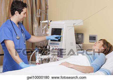 Doctor working on a cardiac monitor screen View Large Photo Image Stock Image - Doctor working on a cardiac monitor screen. Fotosearch