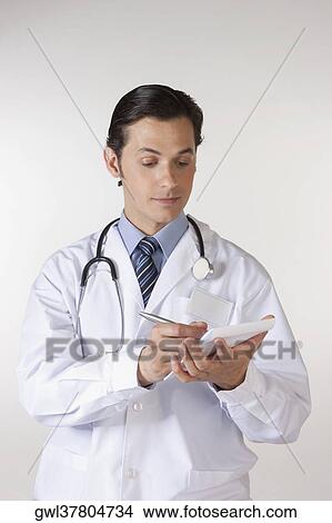 Picture - Doctor writing a prescription. Fotosearch
