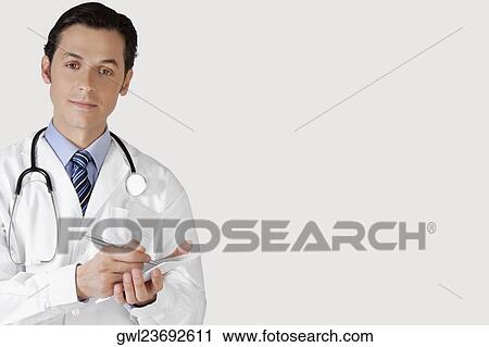 Stock Image - Doctor writing a prescription. Fotosearch